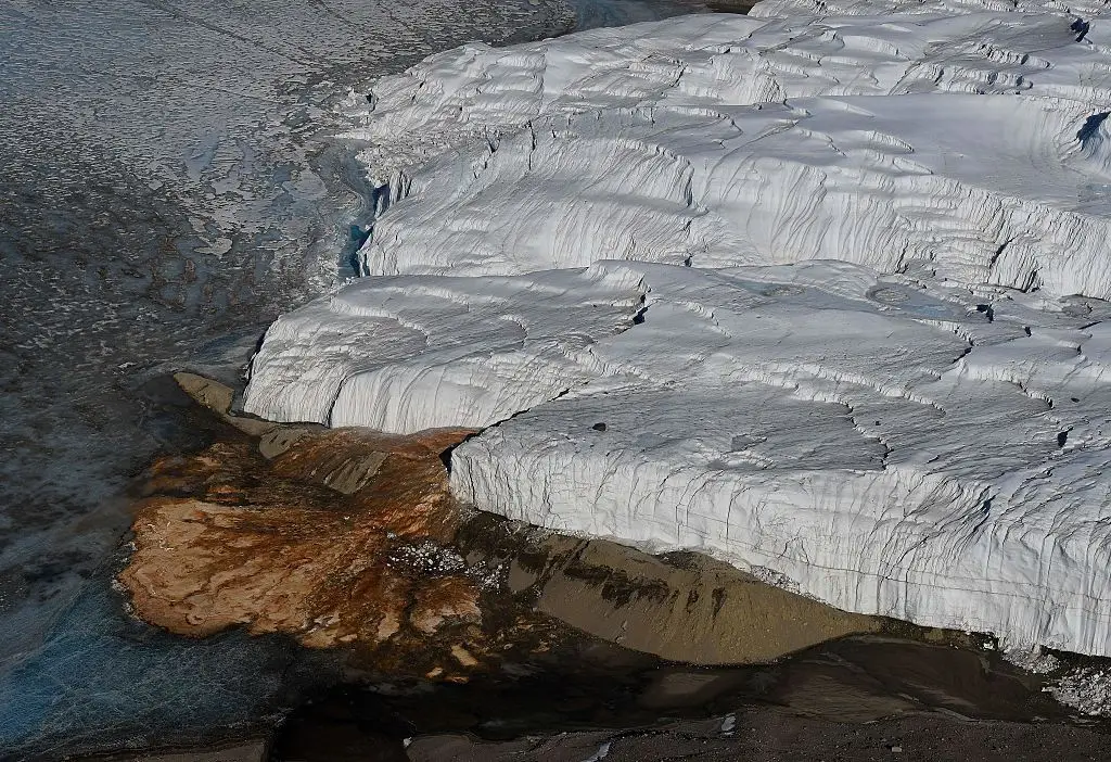 Salty brine present within the water flowing from Blood Falls causes the ice to oxidize and create a rust-like look (Mark Ralson/AFP via Getty Images)