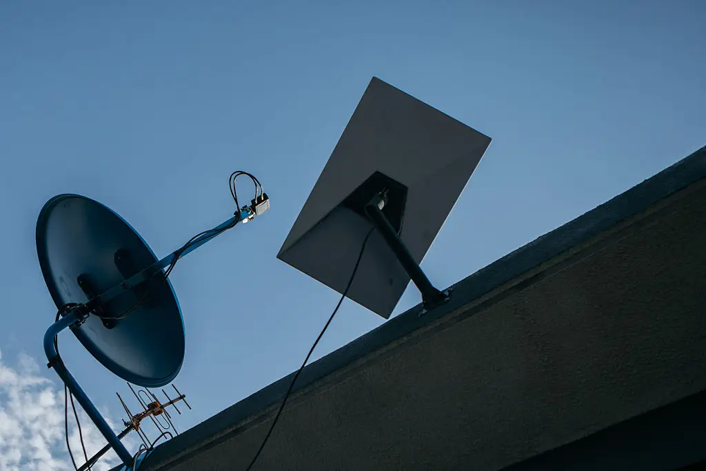 SpaceX aims to use Starlink dishes to avoid the heavy development costs of traditional cell towers (Kang-Chun Cheng/Bloomberg via Getty Images)