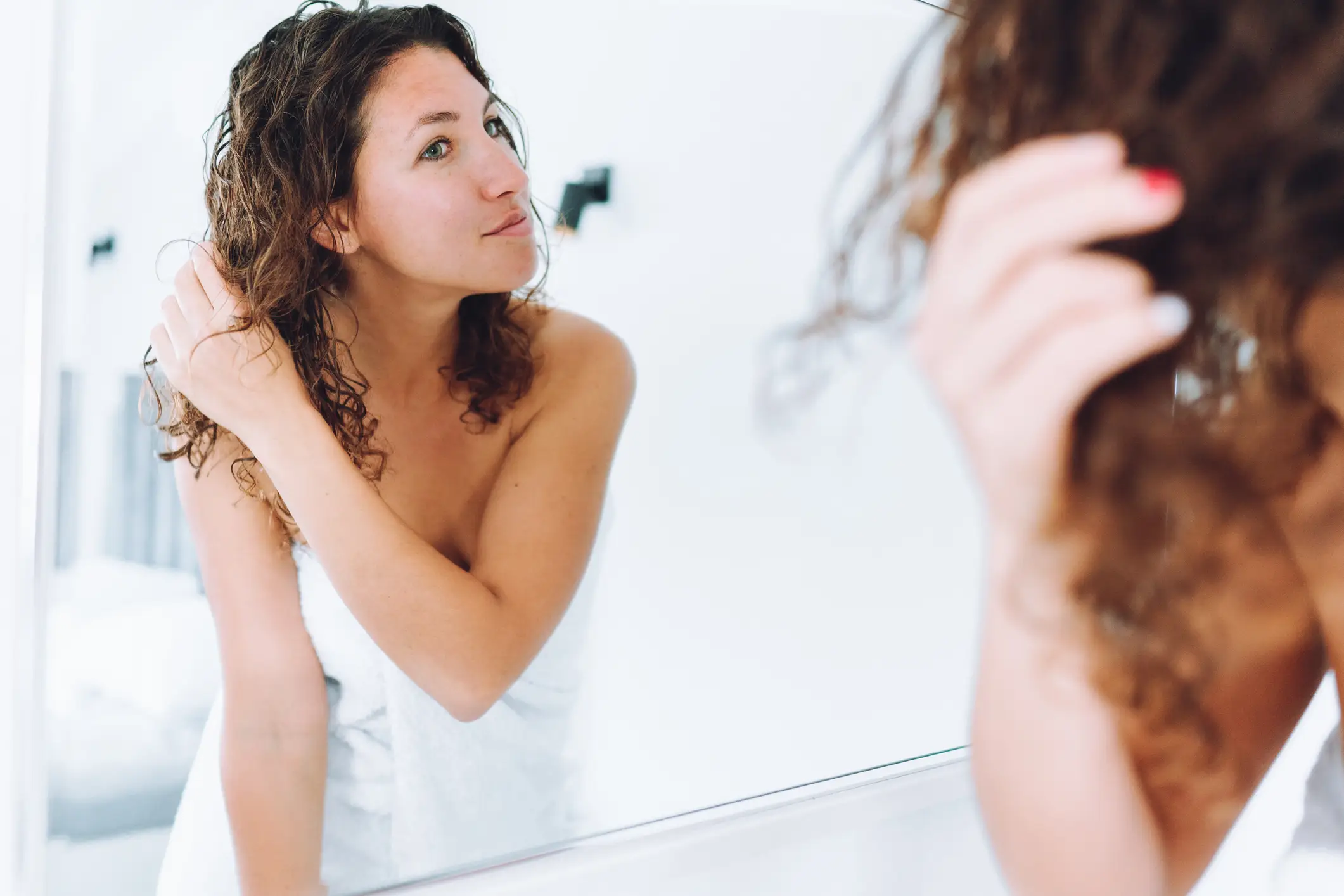 Washing your hair five or six times a week appears to be the sweet spot for fresher-looking hair (Olga Rolenko/Getty)