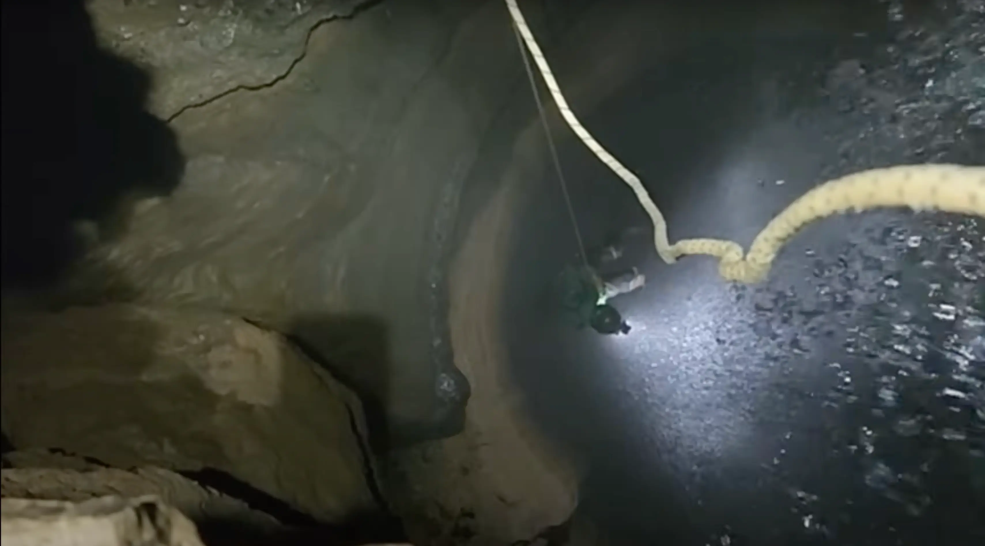 The team encountered an underground waterfall during their expedition (YouTube/@ActionAdventureTwins)