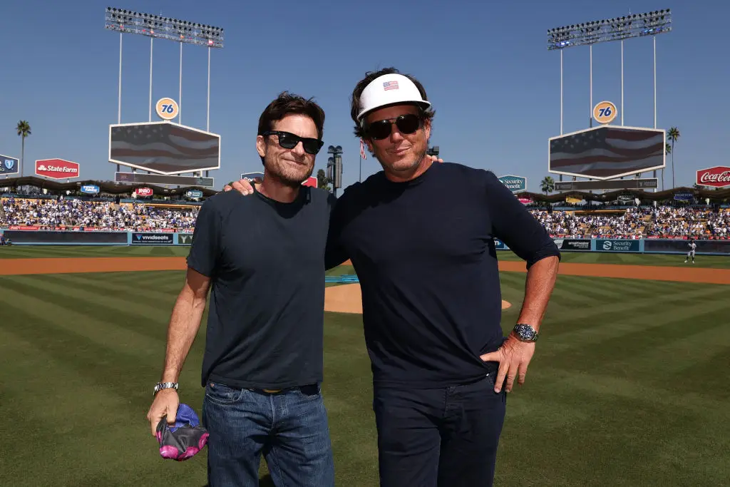 Jason Bateman, pictured here with co-host Will Arnett, interviewed Tim Walz for their podcast (Michael Owens/MLB Photos via Getty Images)