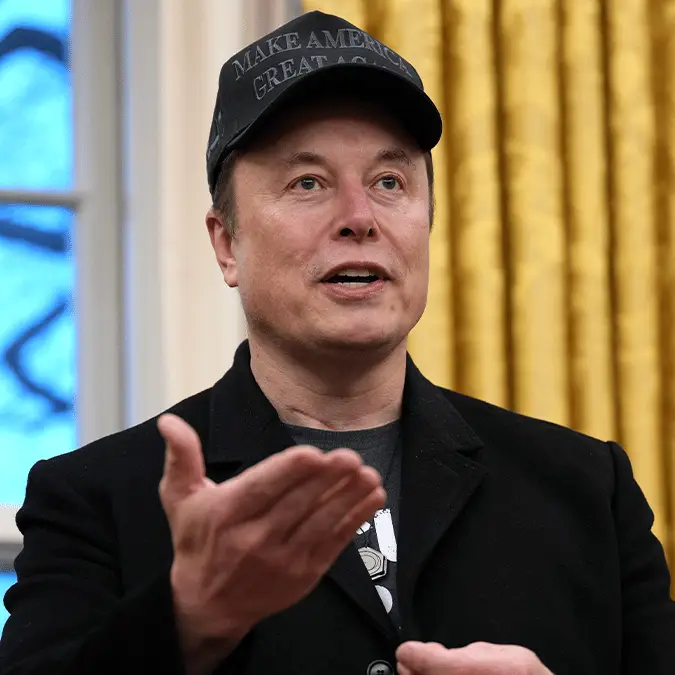 Elon Musk quizzed over condoms as he admits 'we all make mistakes' whilst 4-year-old son is sat on his shoulders