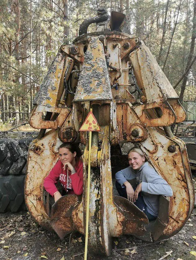 A pair of tourists made contact with a radioactive claw for a photo opportunity. (Reddit)