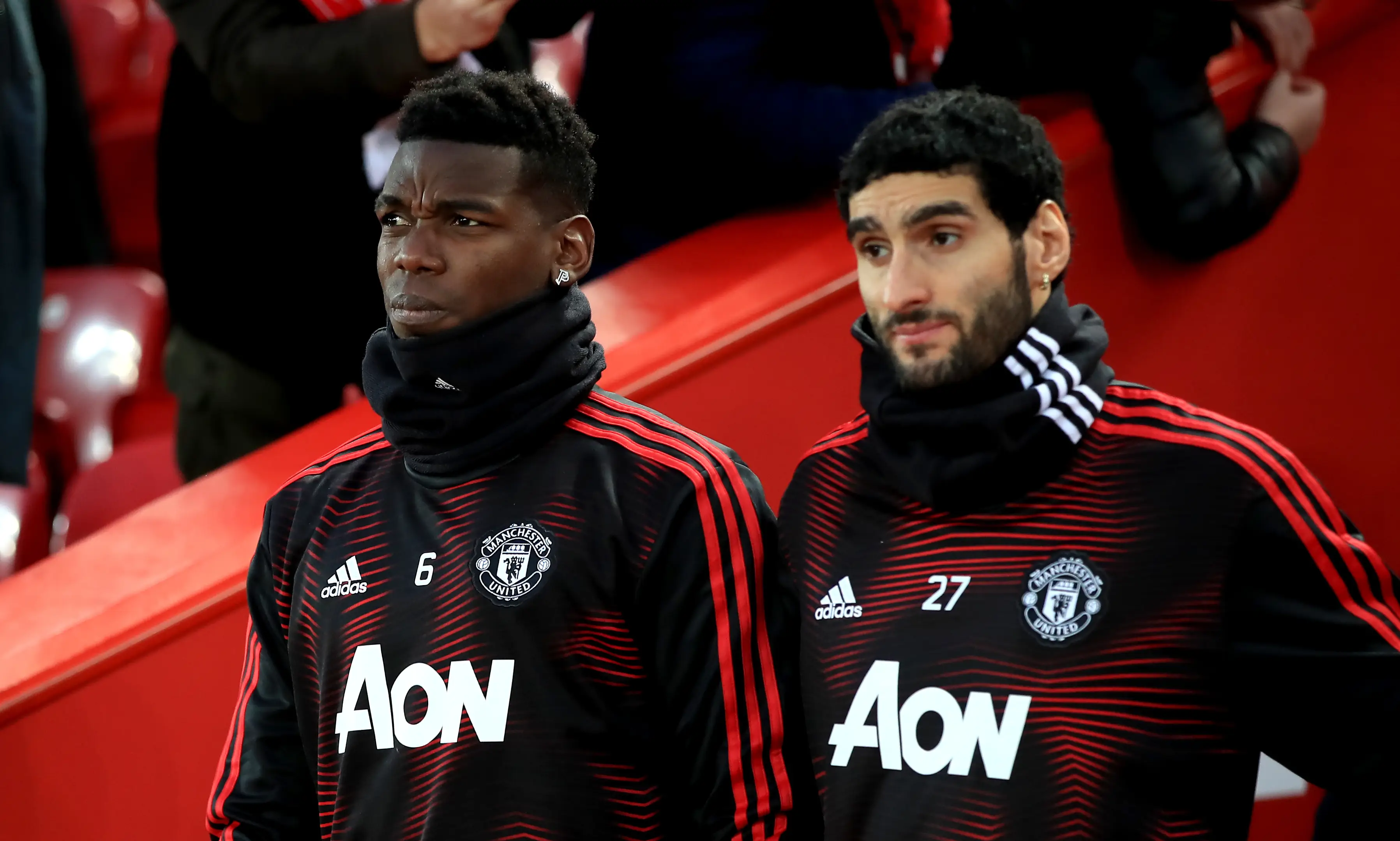 Fellaini on the bench with Paul Pogba in Jose Mourinho's last game in charge. Image: PA Images