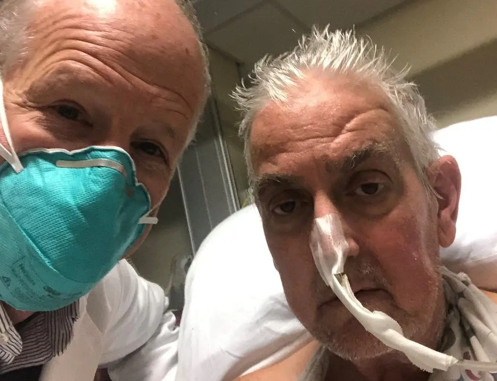 Surgeon Bartley P. Griffith with patient David Bennett.